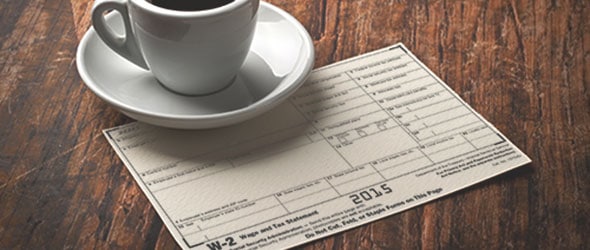 w-2 form receipt on a wooden surface